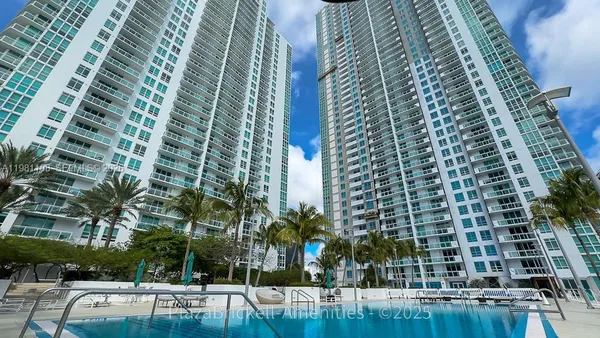 a view of swimming pool with outdoor seating