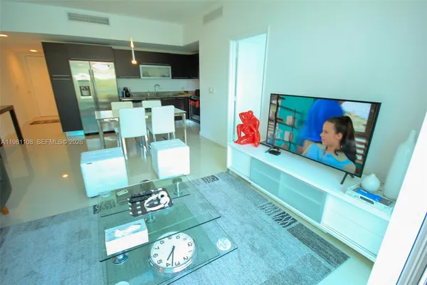 a living room with furniture and a table