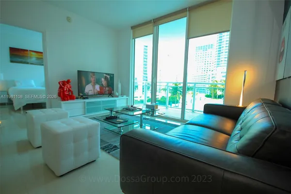 a living room with furniture and a flat screen tv