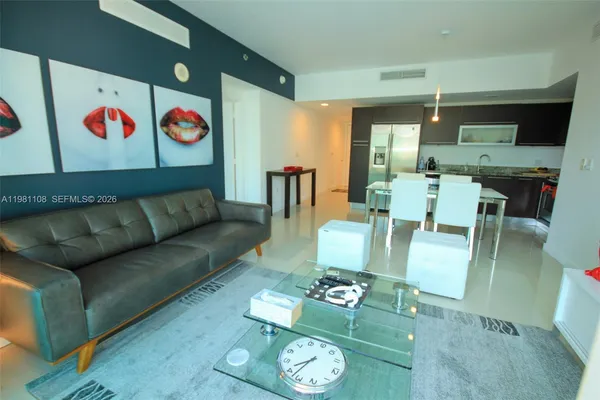 a living room with furniture and a table