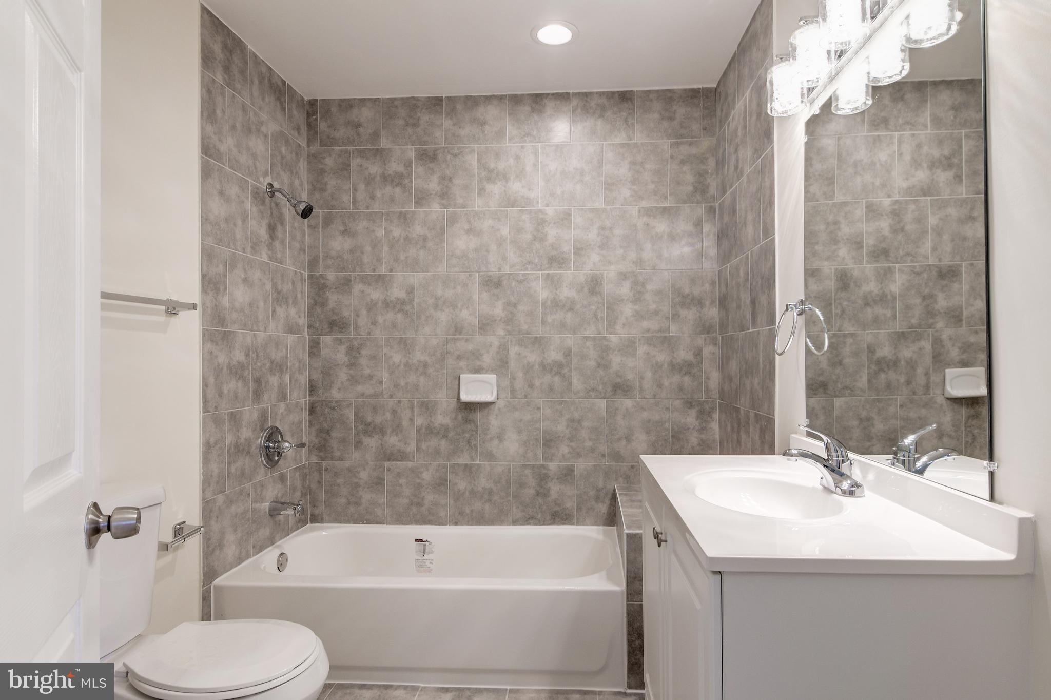 9007 Ardmore Road Springdale, MD 20706 - Photo 22 of 56 Brand New full bathroom off of the living room