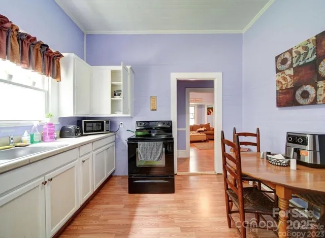 a kitchen with stainless steel appliances granite countertop a refrigerator and sink