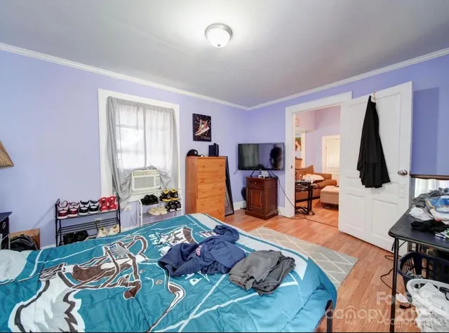 a living room with furniture or couch and a flat screen tv