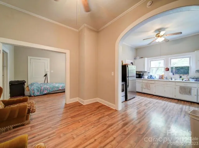 a view of a kitchen and kitchen with wooden floor