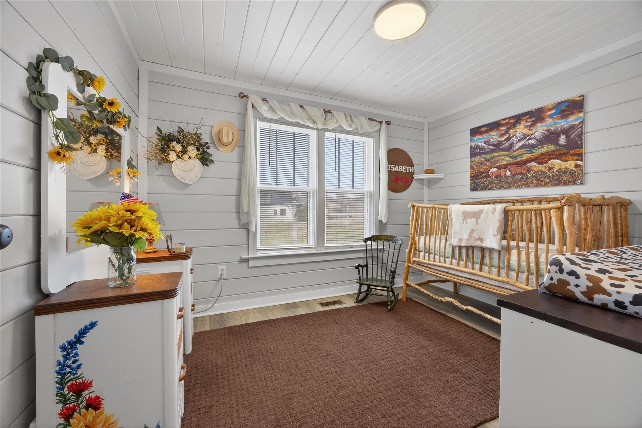 3212 Marthas Chapel Road Cunningham, TN 37052 - Photo 12 of 32 a bedroom with furniture and a window