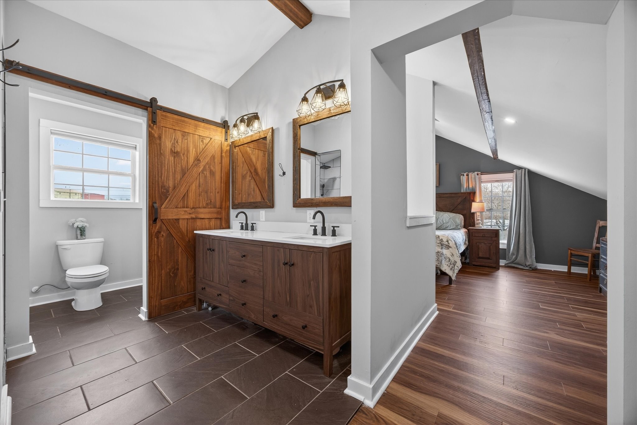 3212 Marthas Chapel Road Cunningham, TN 37052 - Photo 18 of 32 a spacious bathroom with a toilet a sink and mirror
