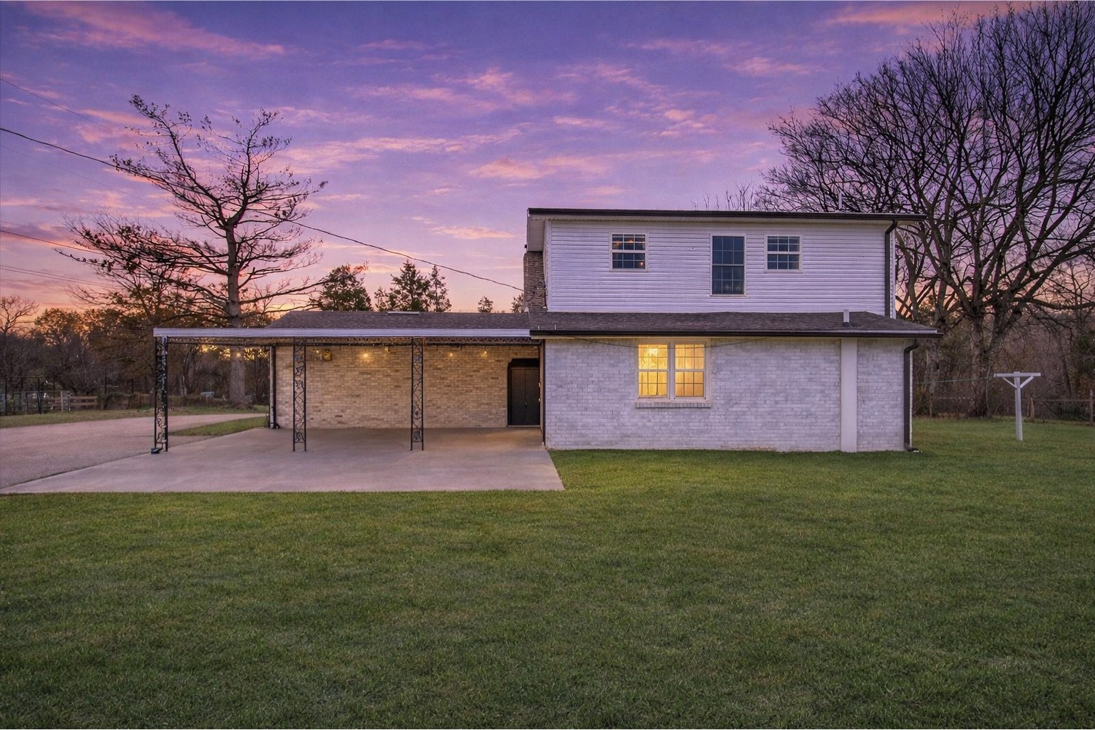 3212 Marthas Chapel Road Cunningham, TN 37052 - Photo 23 of 32 a front view of a house with a yard and a large tree