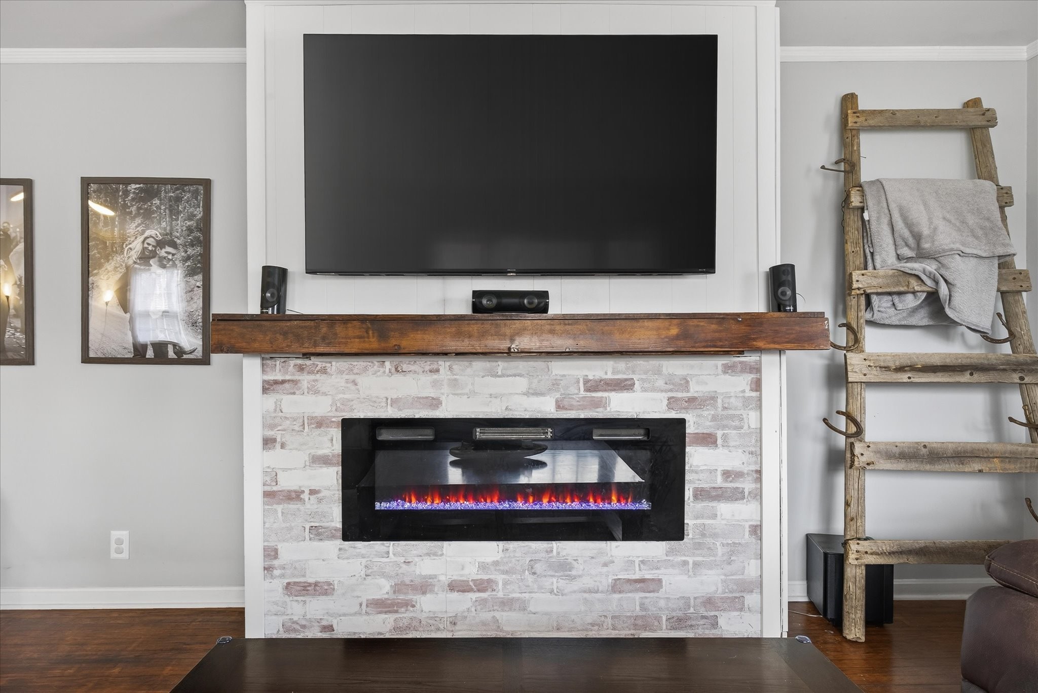 3212 Marthas Chapel Road Cunningham, TN 37052 - Photo 3 of 32 a living room with a fireplace and a flat screen tv