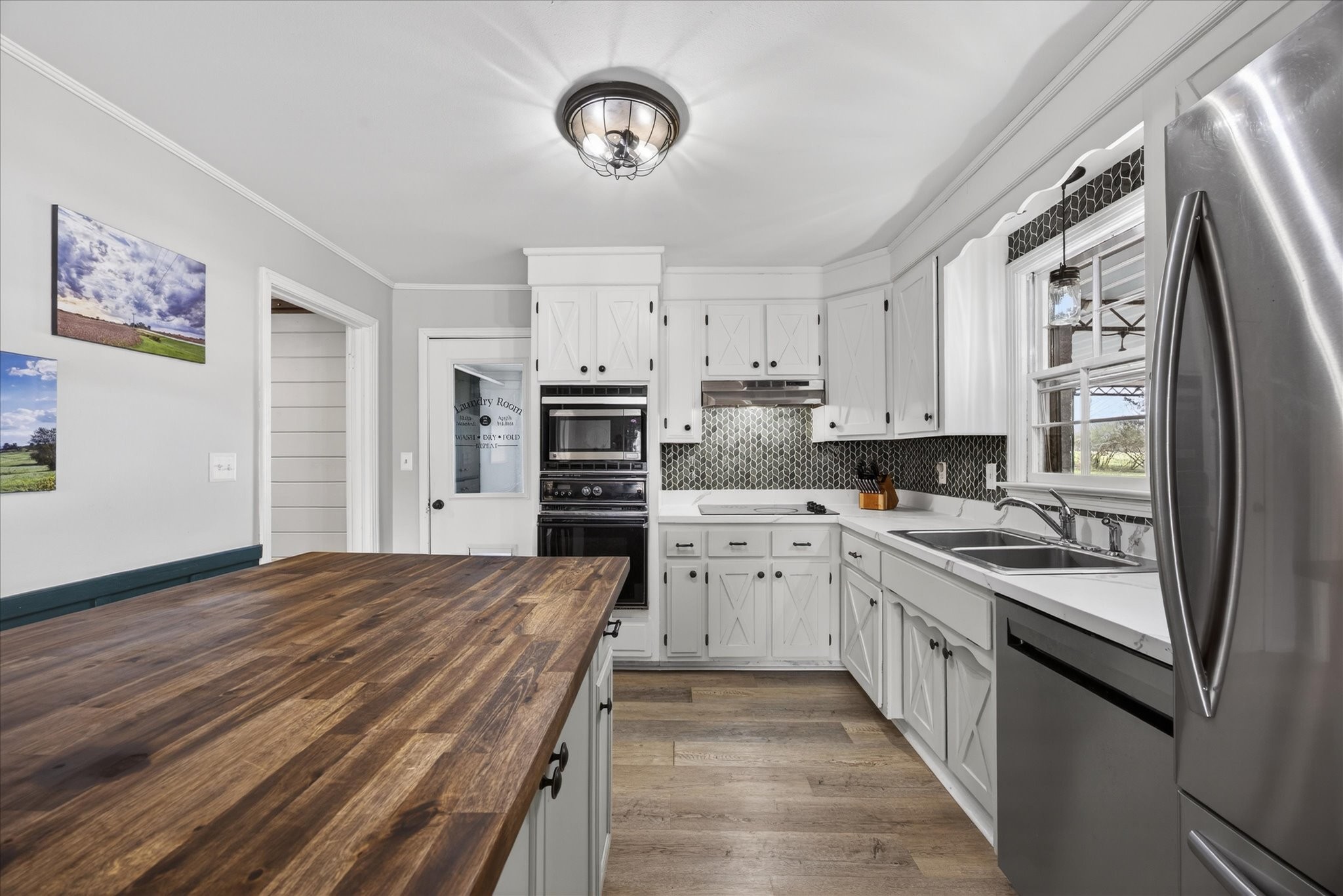 3212 Marthas Chapel Road Cunningham, TN 37052 - Photo 7 of 32 a kitchen with stainless steel appliances a stove sink and refrigerator