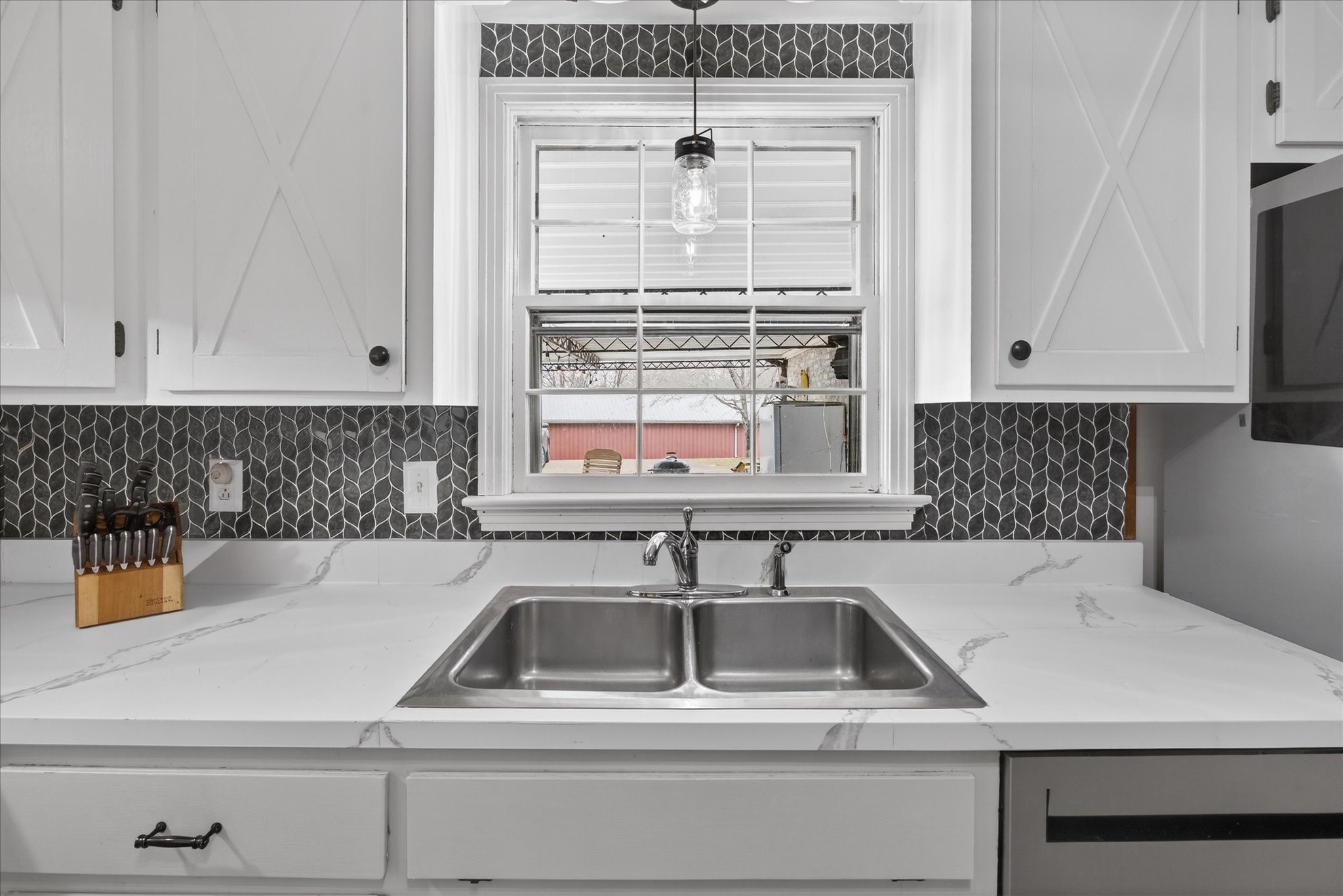 3212 Marthas Chapel Road Cunningham, TN 37052 - Photo 9 of 32 a kitchen with a sink and white cabinets