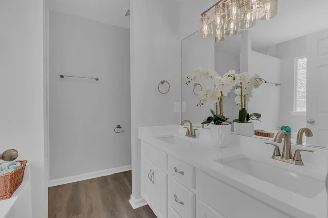 a bathroom with a sink vanity and a mirror