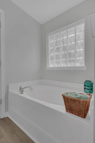 a bath tub sitting next to a window
