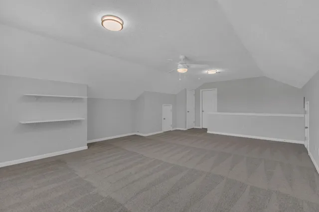 an empty room with shelves