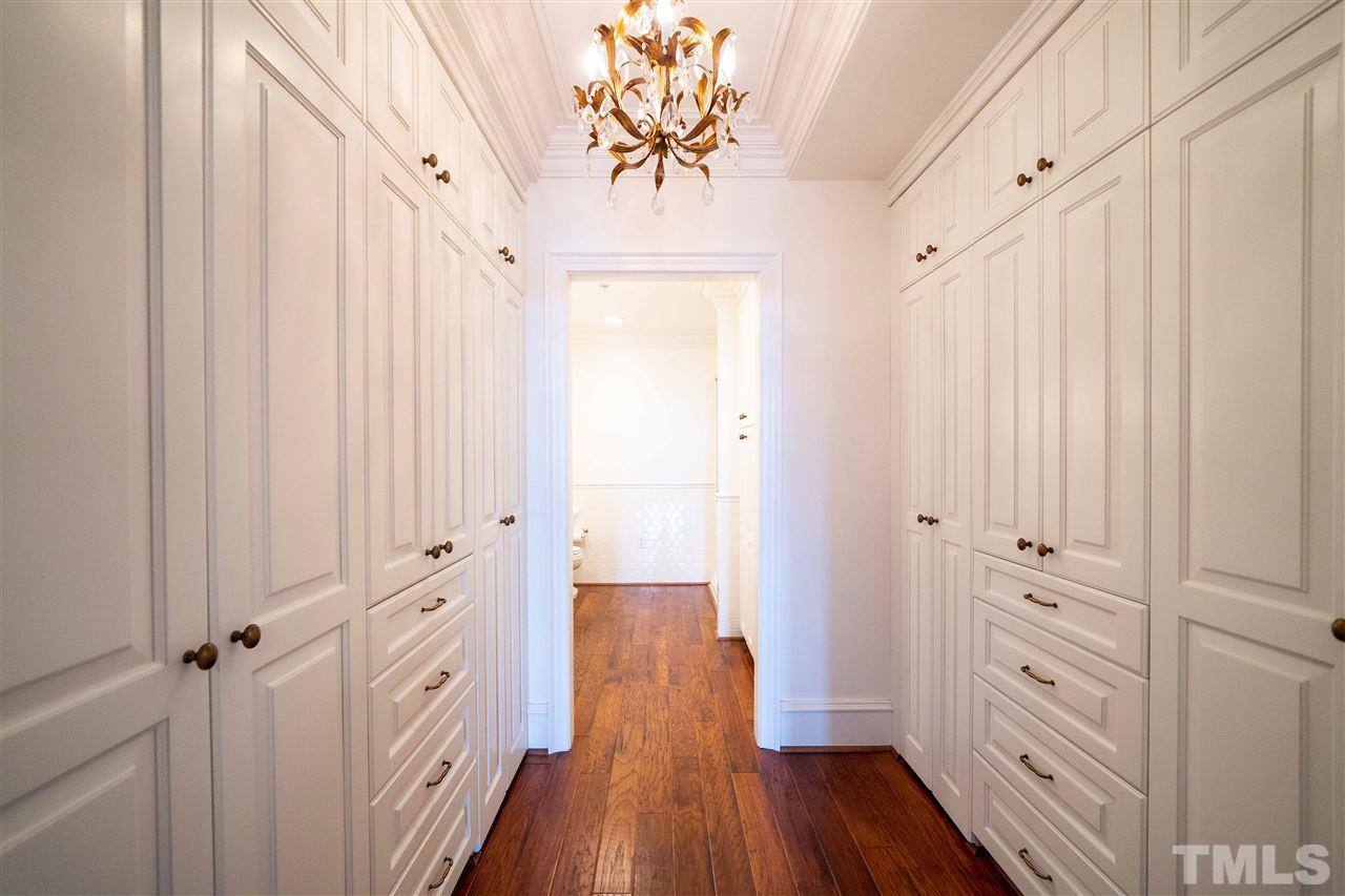 710 Independence Place, Unit 407 Raleigh, NC 27603 - Photo 13 of 27 a view of a hallway with wooden floor
