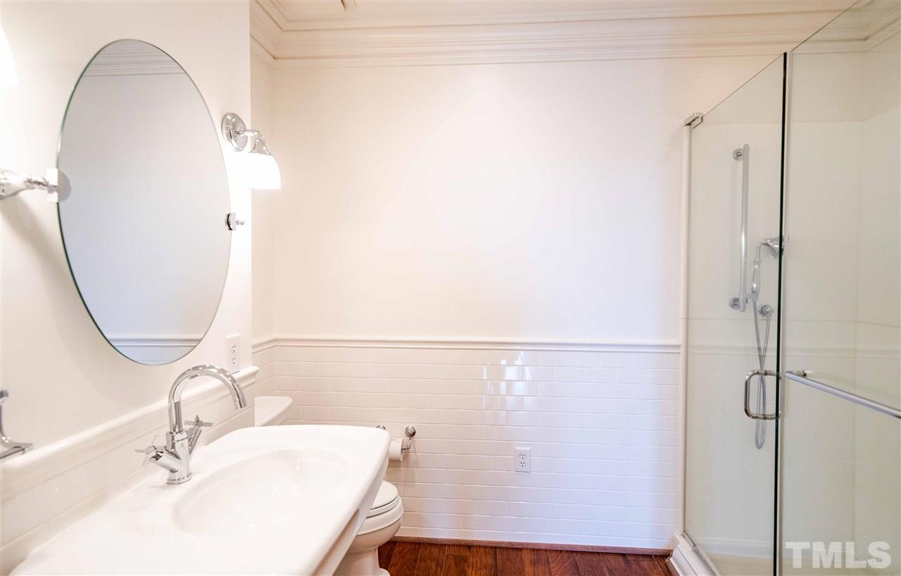 710 Independence Place, Unit 407 Raleigh, NC 27603 - Photo 14 of 27 a bathroom with a sink and a mirror