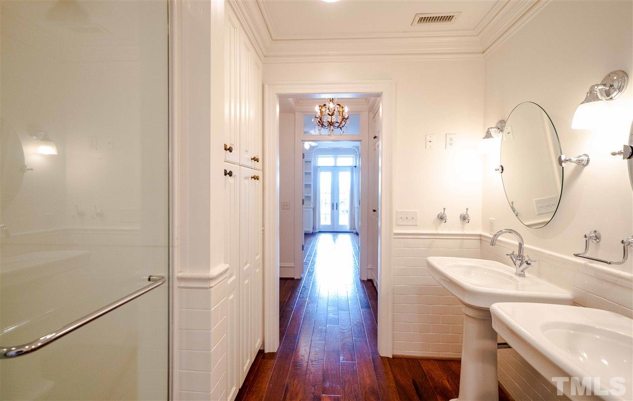 710 Independence Place, Unit 407 Raleigh, NC 27603 - Photo 15 of 27 a bathroom with a sink and a mirror