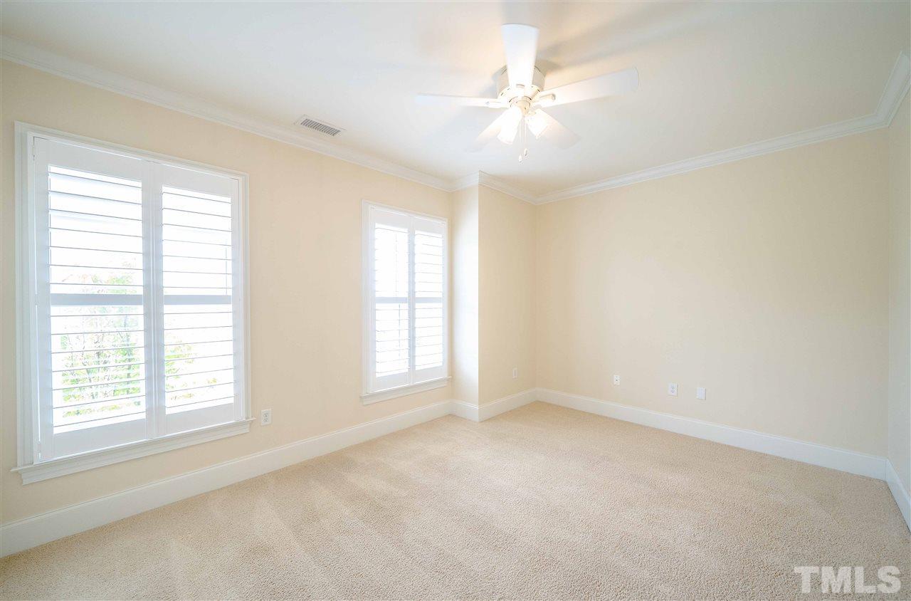 710 Independence Place, Unit 407 Raleigh, NC 27603 - Photo 18 of 27 a view of an empty room with a window