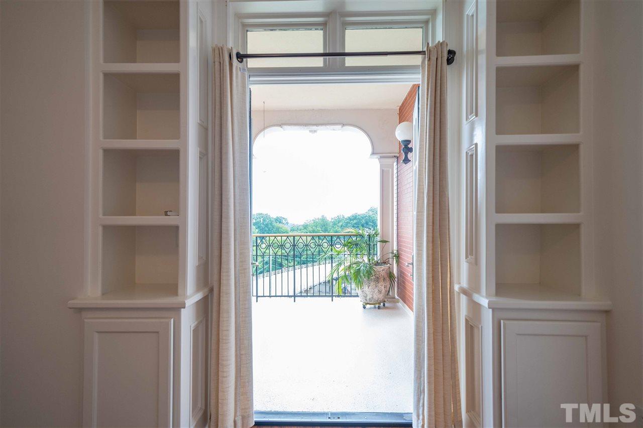 710 Independence Place, Unit 407 Raleigh, NC 27603 - Photo 23 of 27 a room that has a door and a closet in it