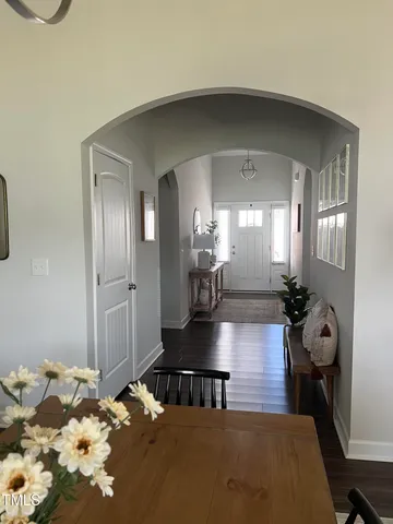 a lobby with a couch and chandelier