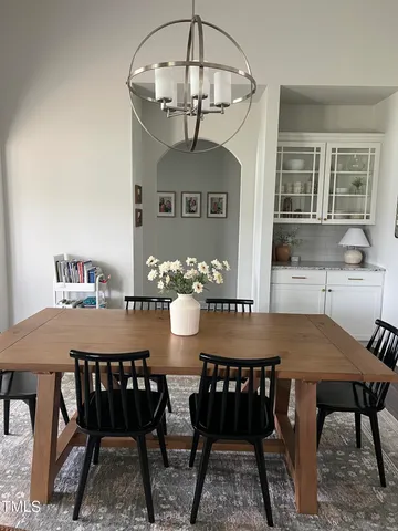 a view of a dining room with furniture and window