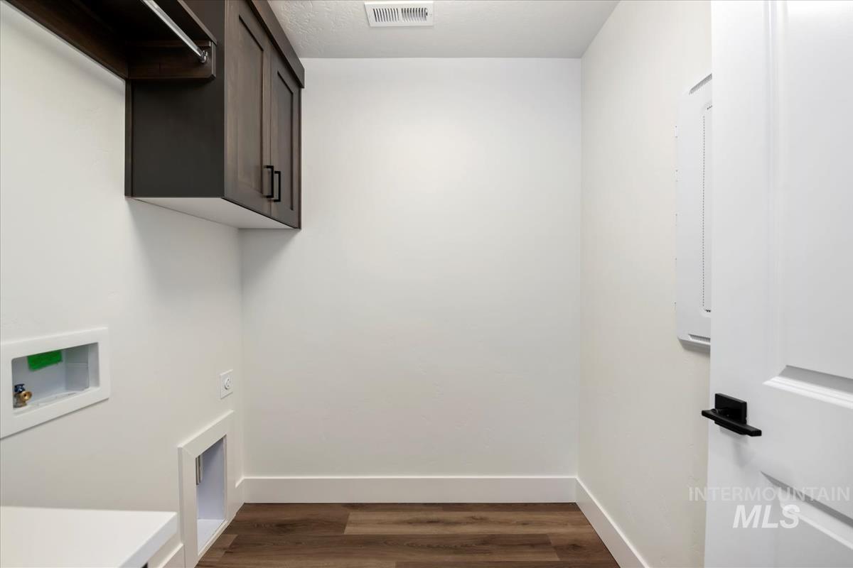 752 South Calhoun Lane Star, ID 83669 - Photo 32 of 45 Dedicated utility room featuring wood-finish flooring and white baseboards
