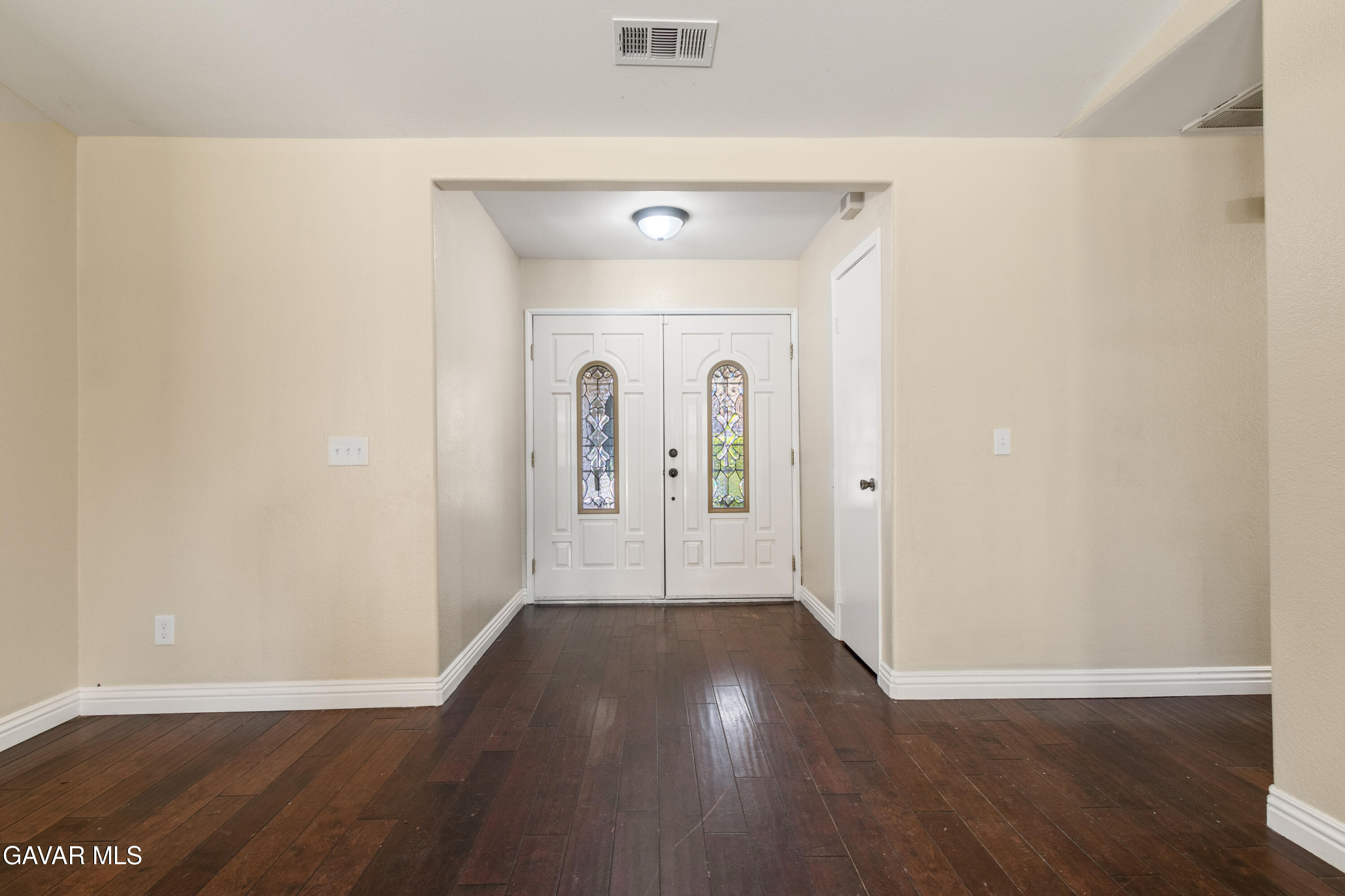 2128 Edam Street Lancaster, CA 93536 - Photo 13 of 26 a view of a hallway with wooden floor