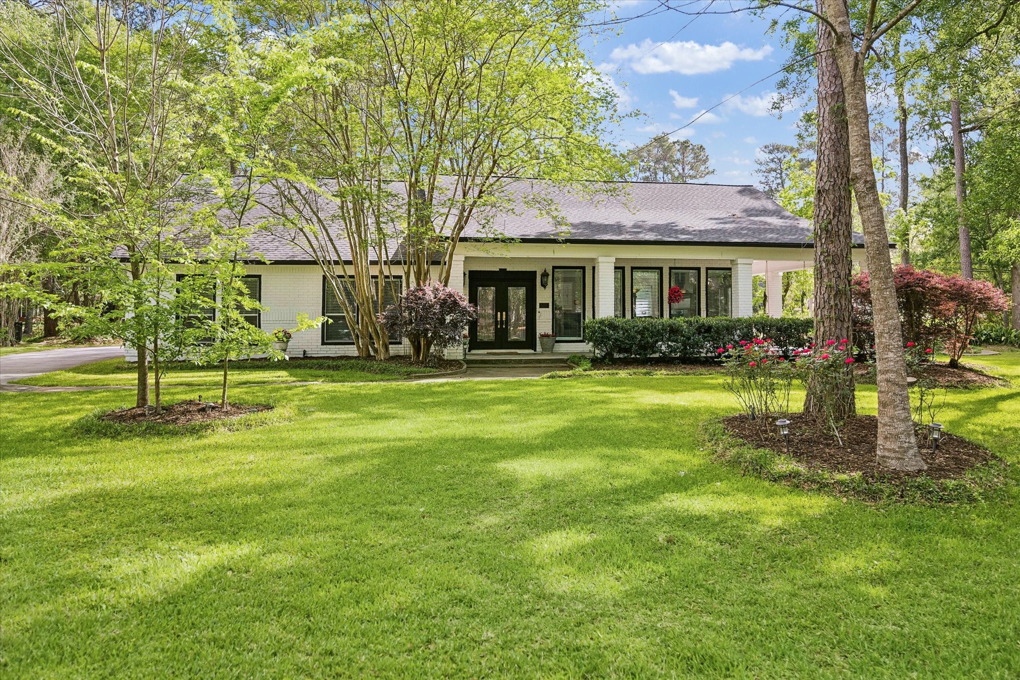 502 Monitor Park Conroe, TX 77302 - Photo 1 of 26 Welcome Home to 502 Monitor Park! Set on two oversized lots and framed by mature trees, this home pairs charming curb appeal with a fully insulated and plumbed built-out garage, along with a fresh exterior paint refresh completed in 2024.