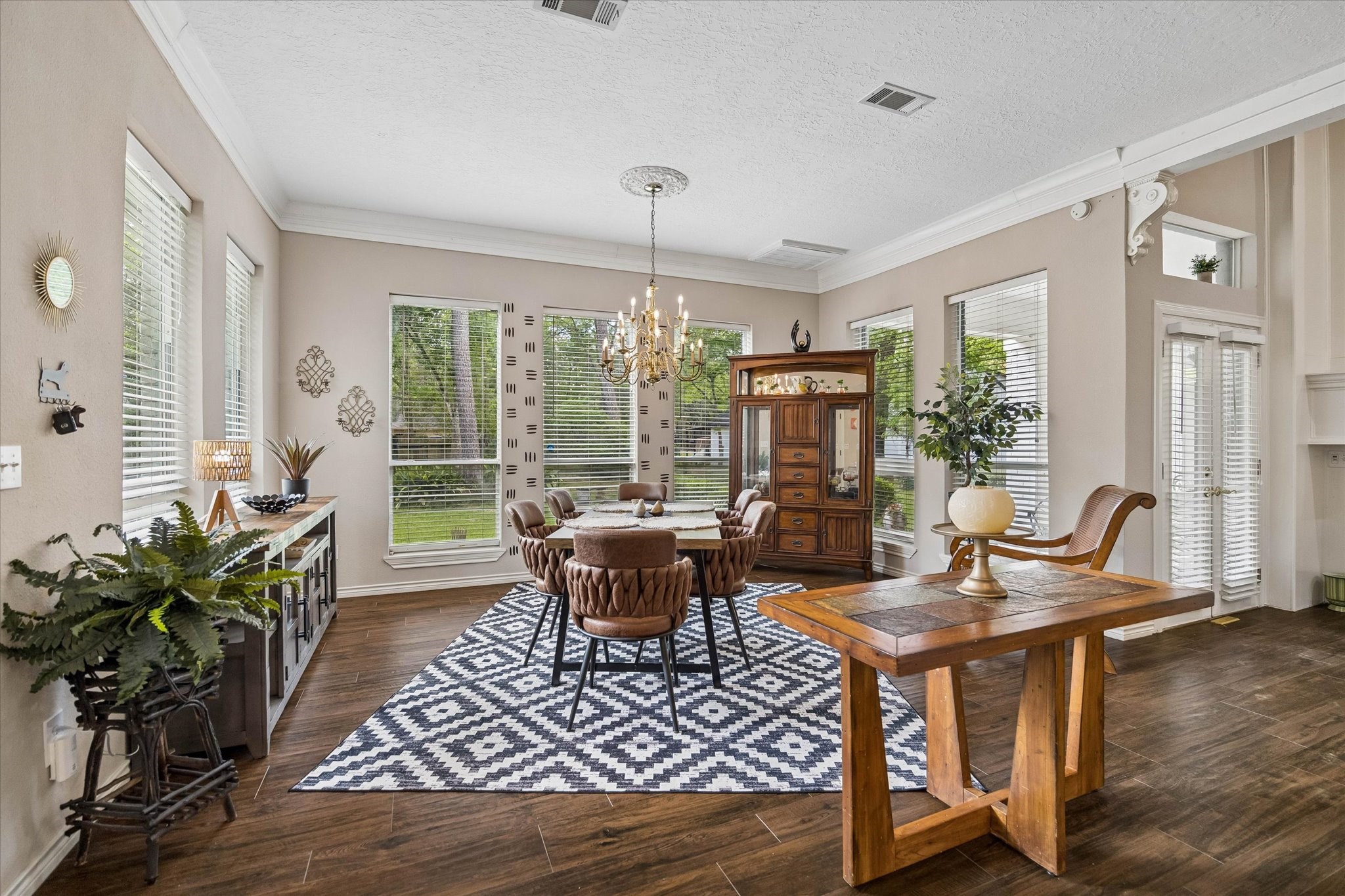 502 Monitor Park Conroe, TX 77302 - Photo 11 of 26 With windows at every turn, the living and dining spaces are filled with natural light and uninterrupted views of the surrounding greenery.