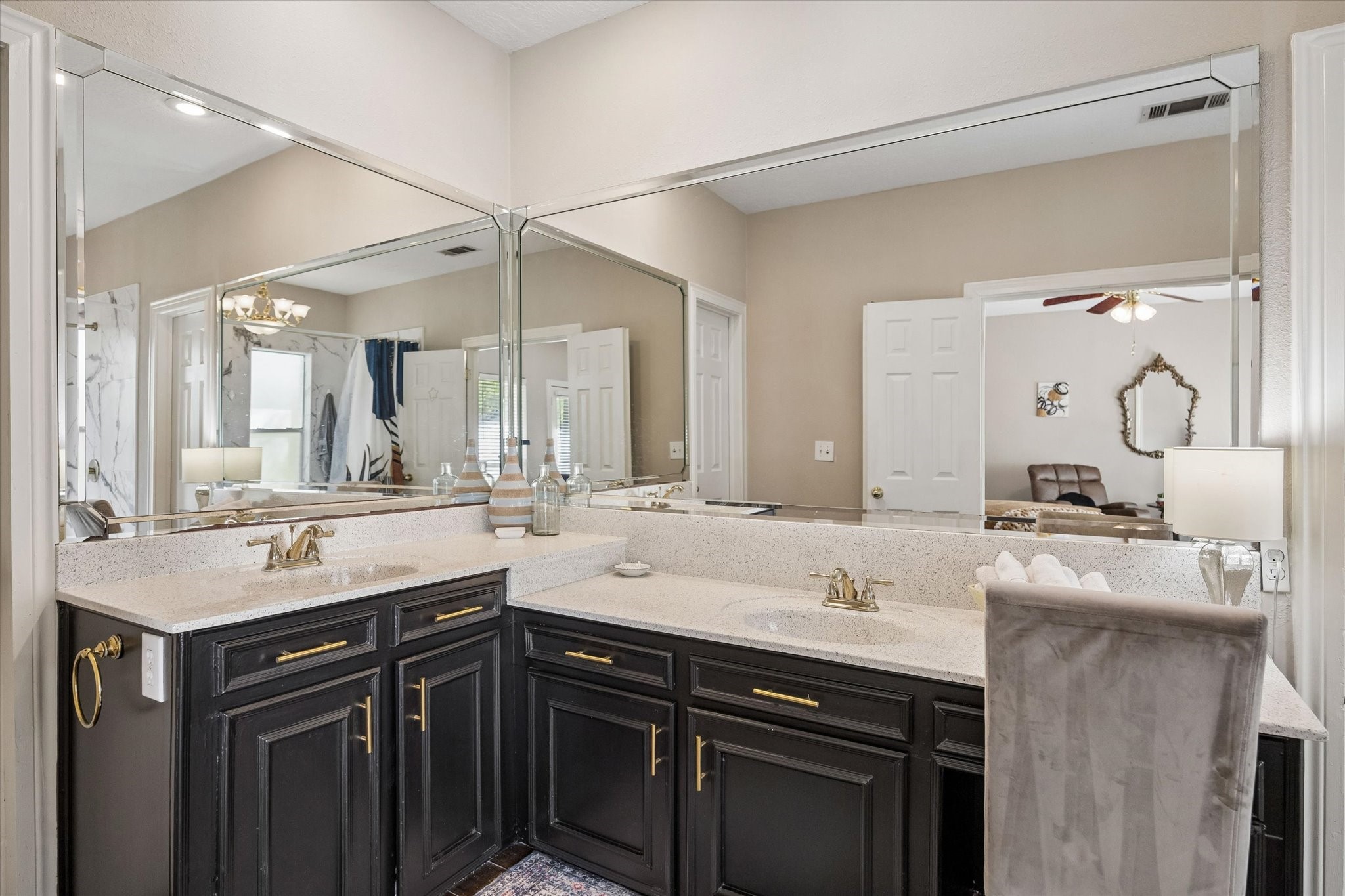 502 Monitor Park Conroe, TX 77302 - Photo 16 of 26 The primary bath is complete with double sinks and a dedicated space for a vanity chair. Not pictured is the primary walk in closet, complete with built ins.