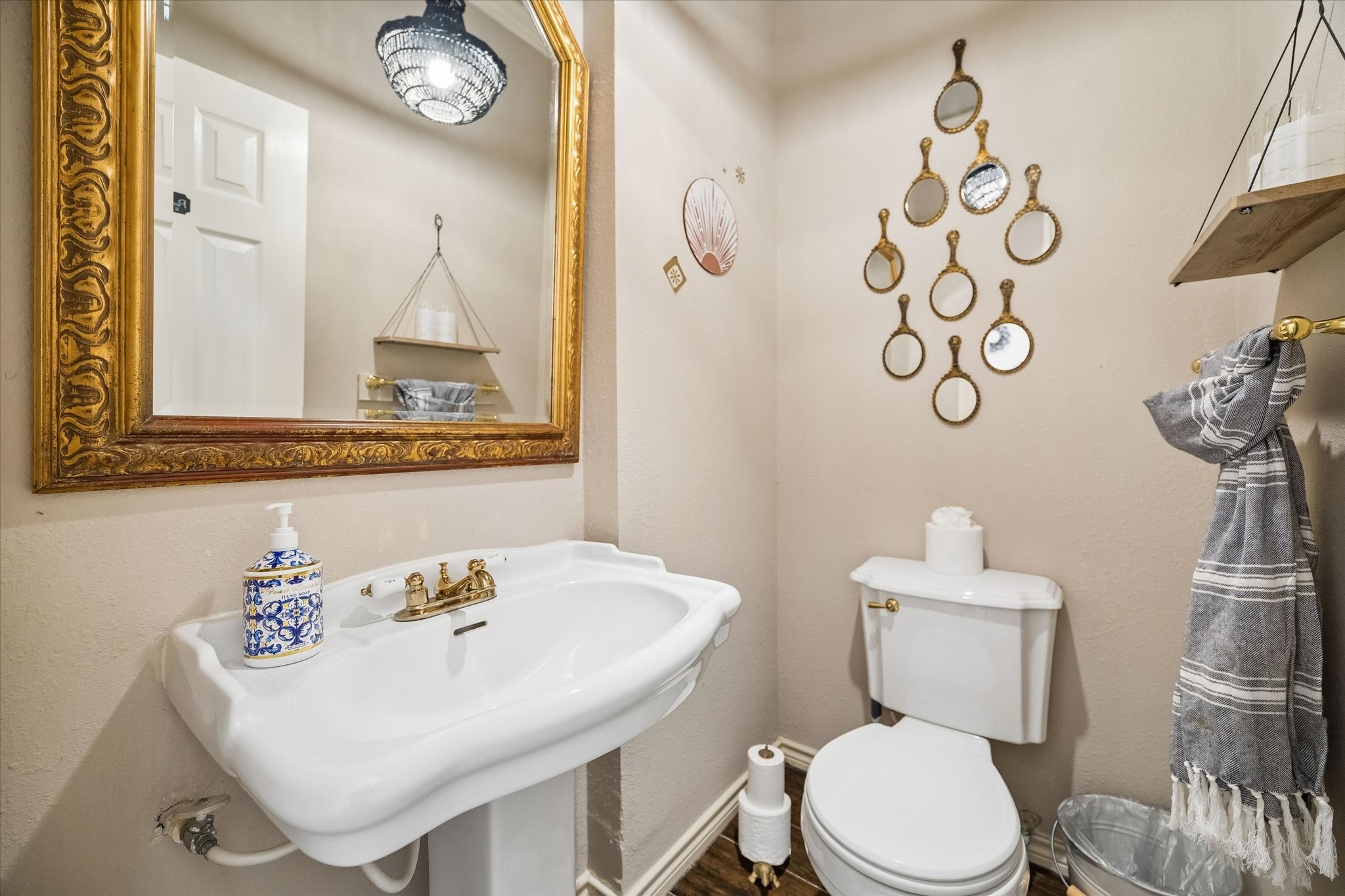 502 Monitor Park Conroe, TX 77302 - Photo 17 of 26 The half bath is a moment on its own. Beautifully styled with warm gold accents that add just the right touch of elegance.