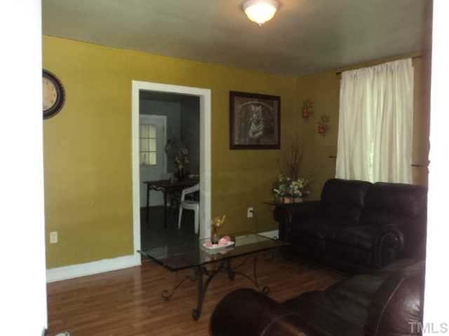 913 South State Street Raleigh, NC 27601 - Photo 2 of 7 a living room with furniture and a window