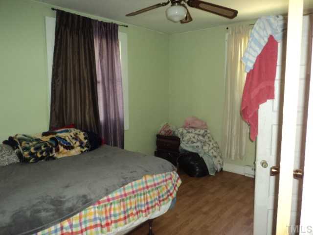 913 South State Street Raleigh, NC 27601 - Photo 7 of 7 a bedroom with a bed and a mirror