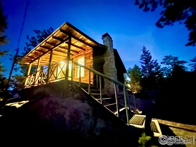 a room with wooden floor and windows