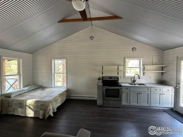 a bathroom with a window and a shower
