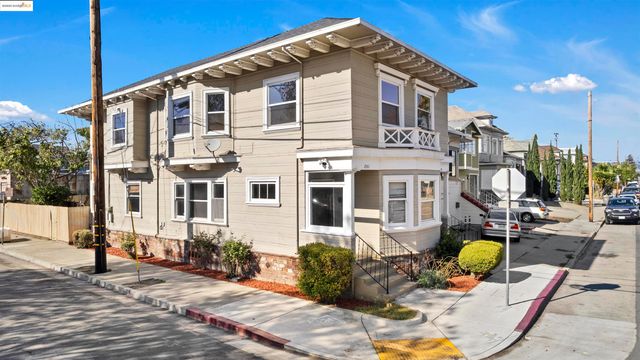 a front view of a house with outdoor seating
