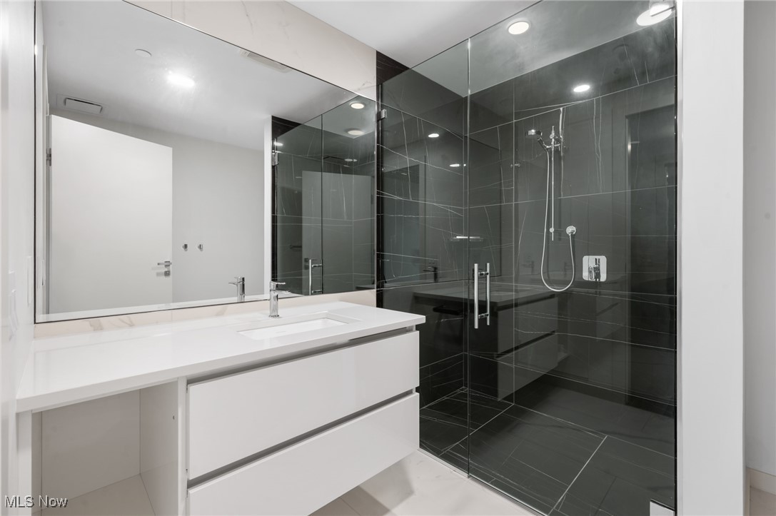22700 Lake Road, Unit 204 Rocky River, OH 44116 - Photo 21 of 31 Full bathroom with vanity, a stall shower, and recessed lighting