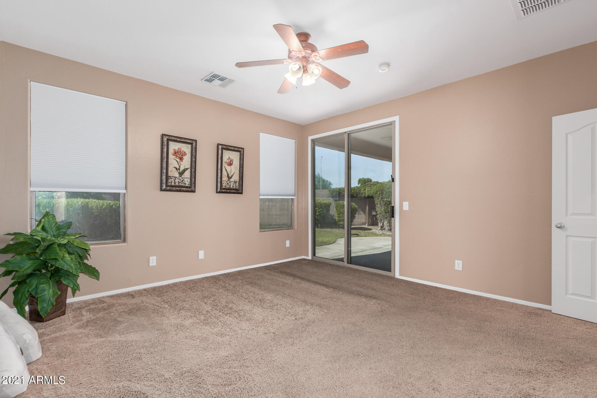 10252 West Cordes Road Tolleson, AZ 85353 - Photo 13 of 33 MASTER BEDROOM SLIDER EXIT TO PATIO