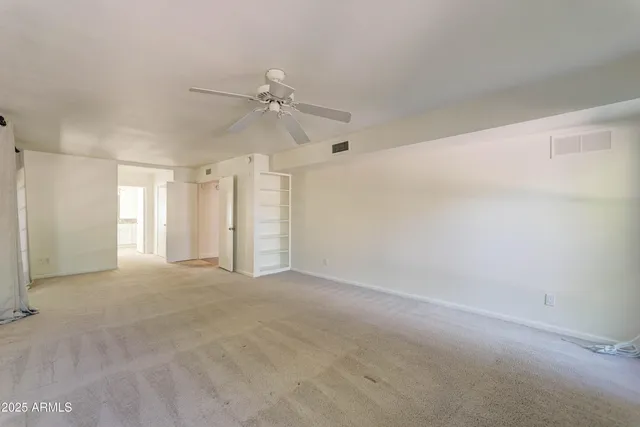 a view of a big room with carpet