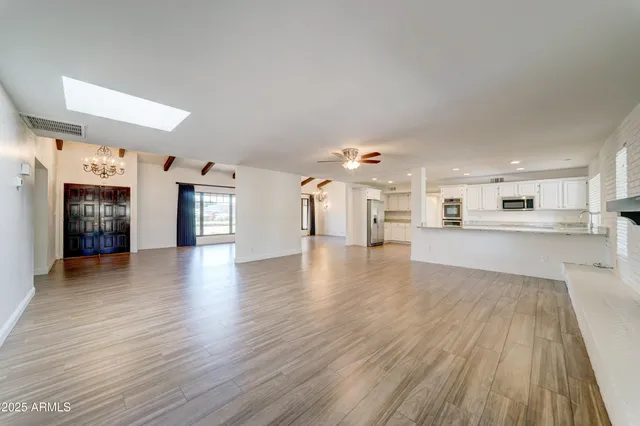 a view of a kitchen with a sink and a stove top oven