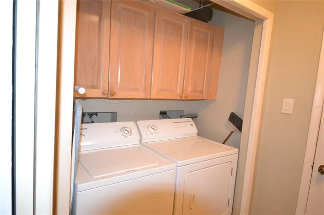 a kitchen with a sink and a refrigerator