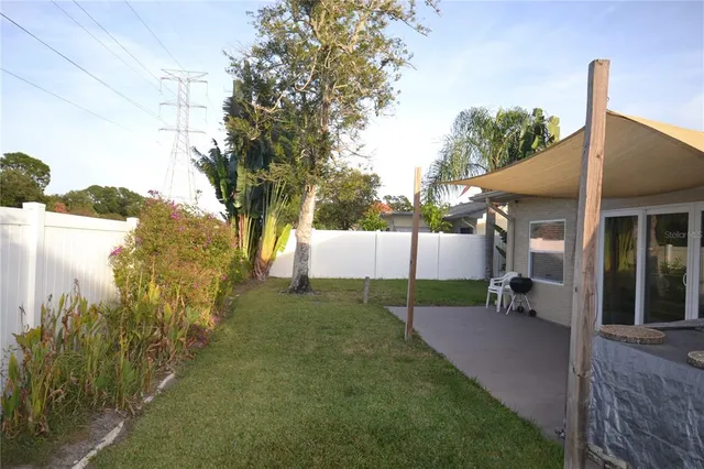 a backyard of a house with lots of green space