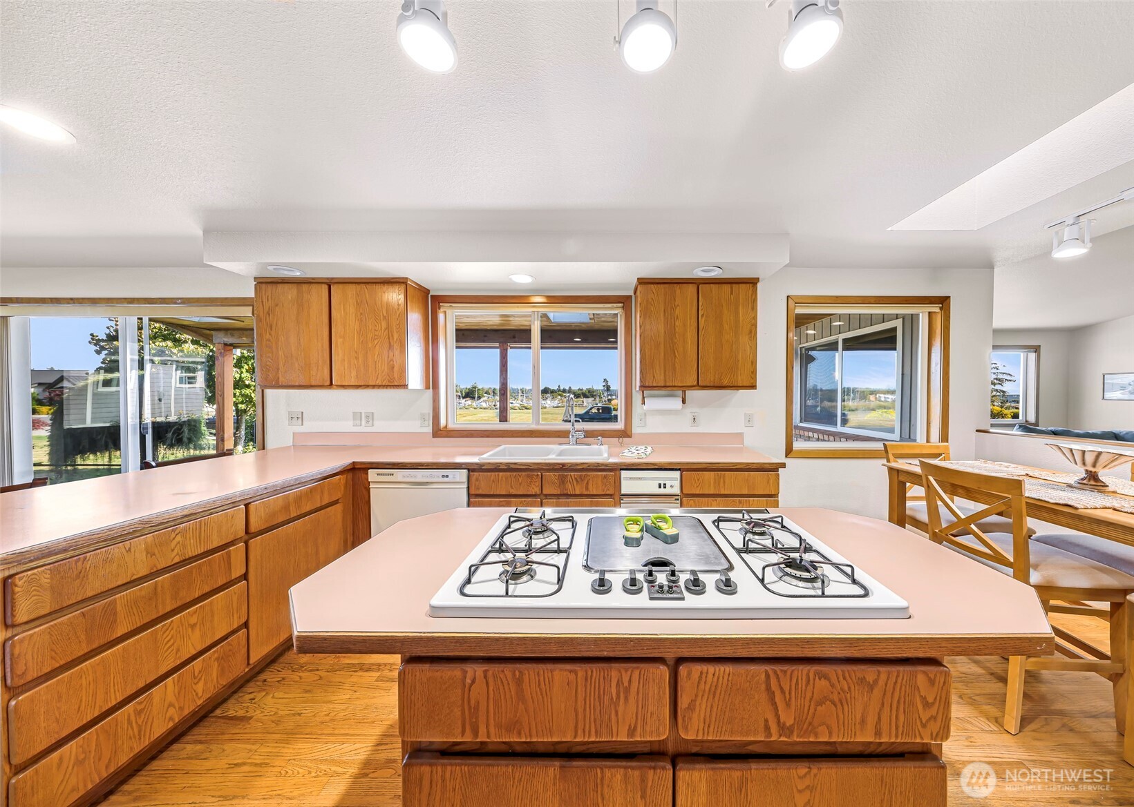 8059 Comox Road Blaine, WA 98230 - Photo 11 of 38 a kitchen with kitchen island a stove and a sink