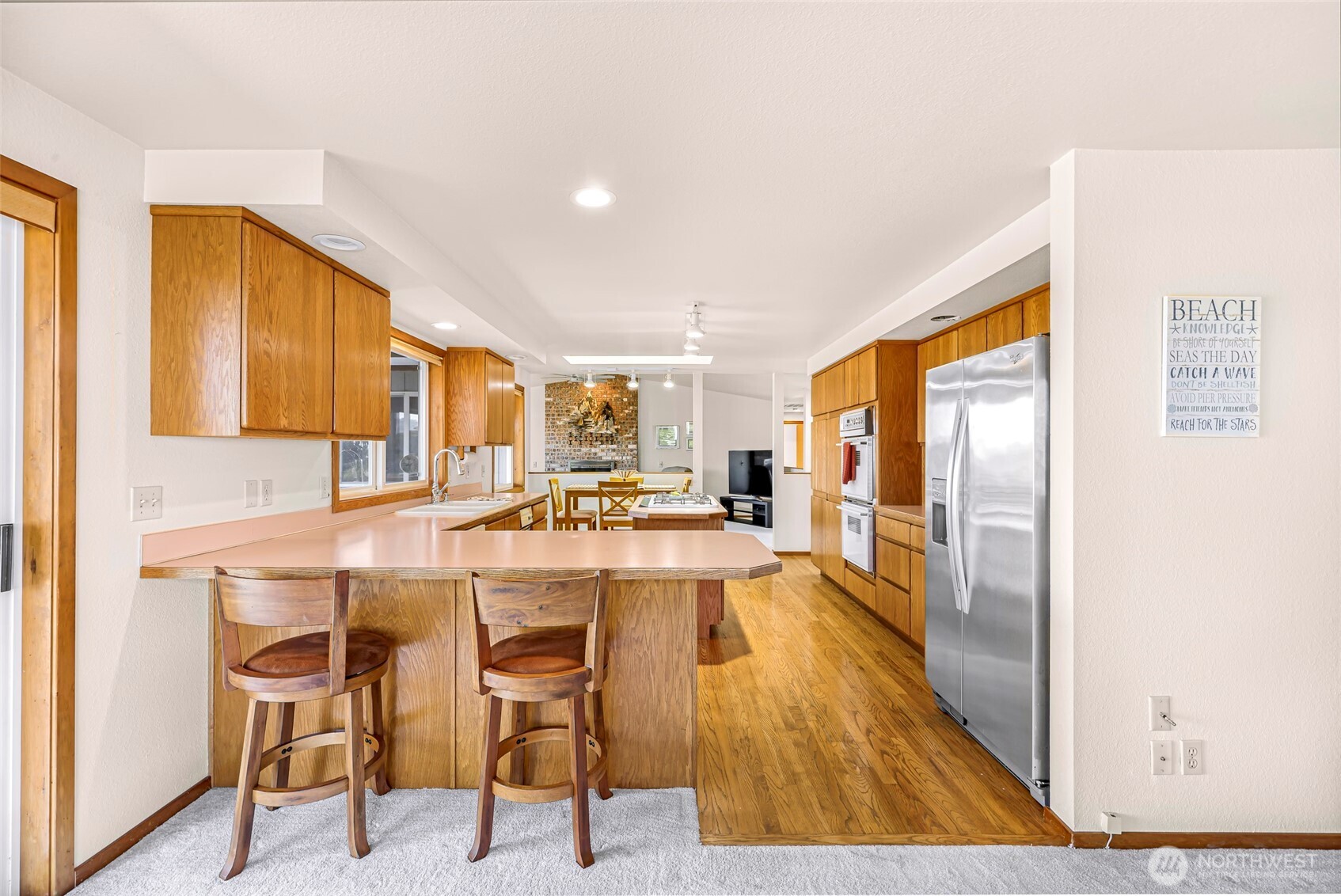 8059 Comox Road Blaine, WA 98230 - Photo 15 of 38 a large kitchen with a table and chairs