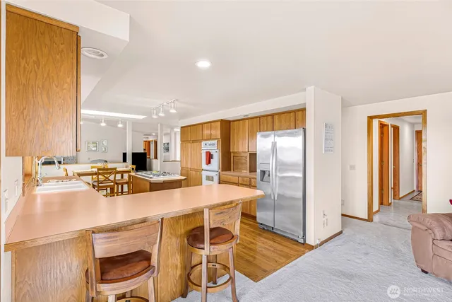 a kitchen with a table and chairs