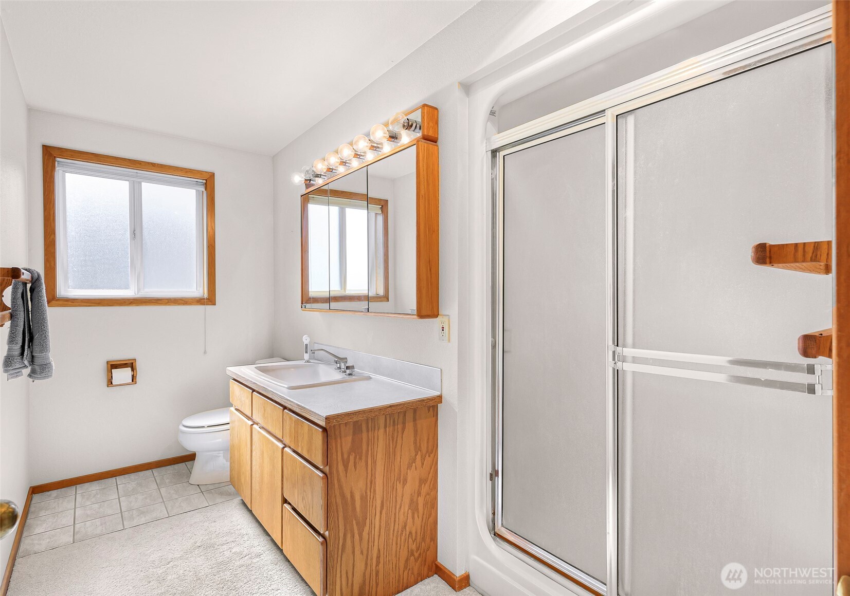 8059 Comox Road Blaine, WA 98230 - Photo 25 of 38 a bathroom with a sink a toilet and shower