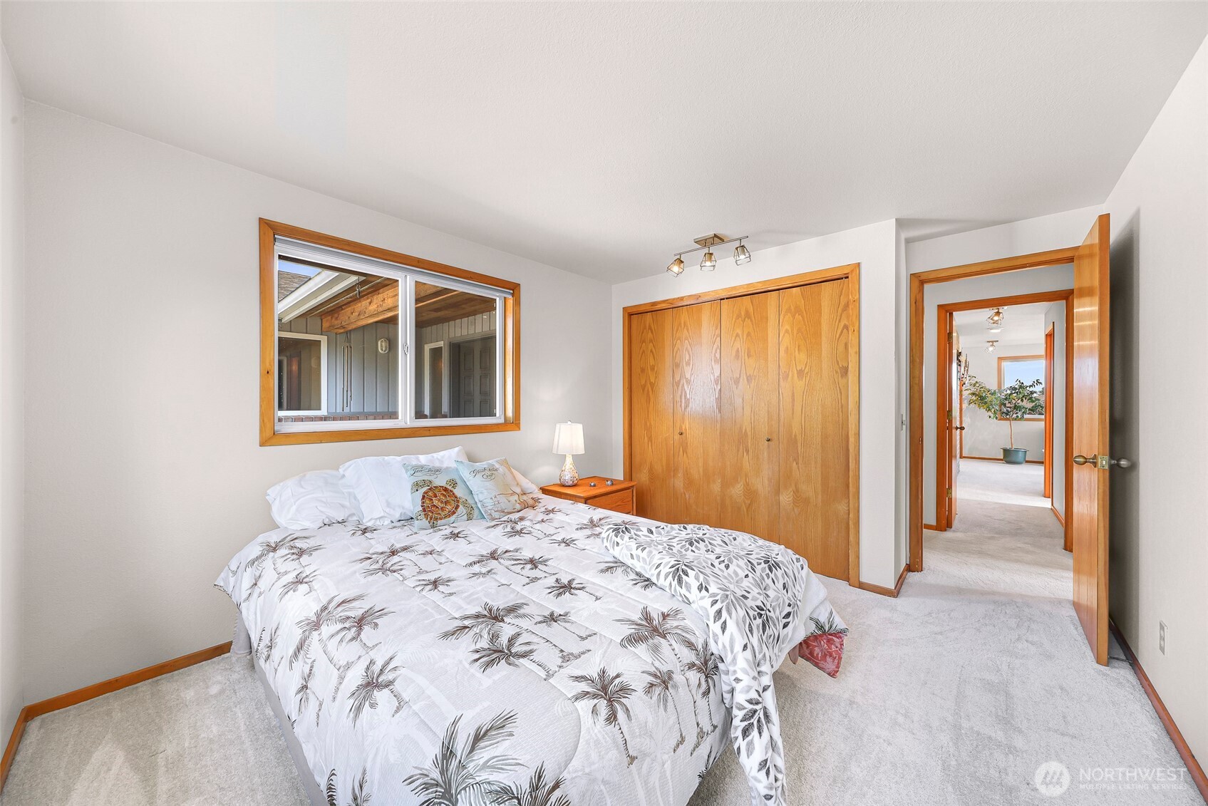 8059 Comox Road Blaine, WA 98230 - Photo 26 of 38 a bedroom with a bed and a window