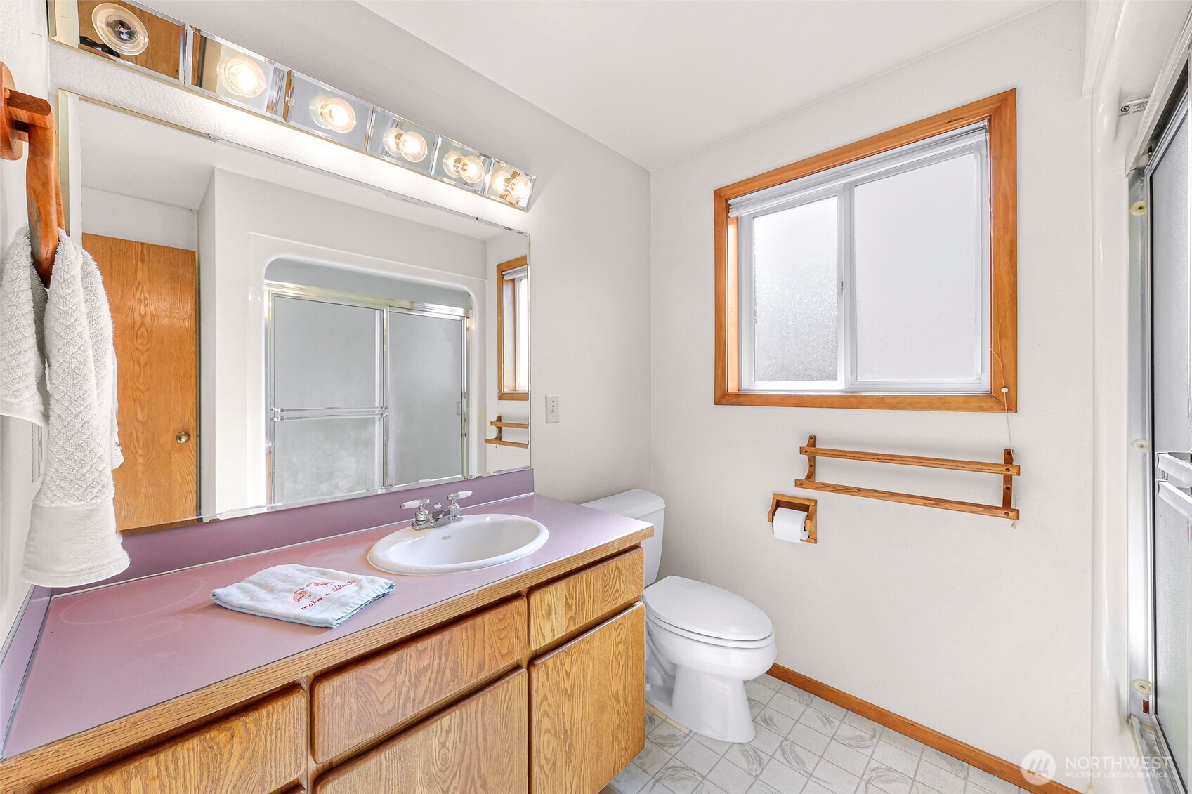 8059 Comox Road Blaine, WA 98230 - Photo 27 of 38 a bathroom with a granite countertop sink toilet and mirror