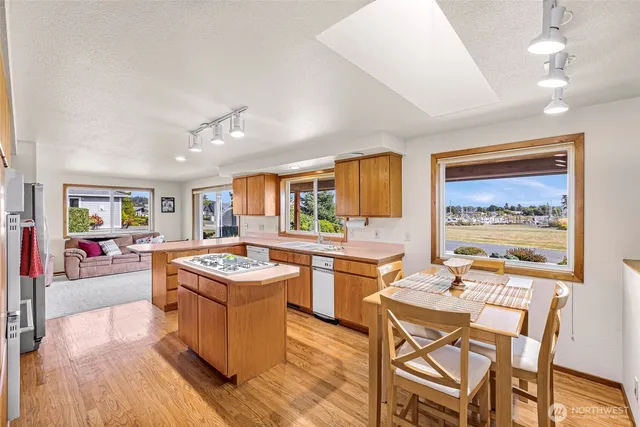 a kitchen with stainless steel appliances granite countertop a stove and a refrigerator
