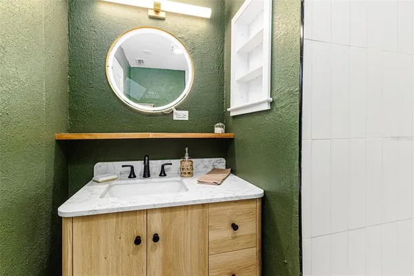 a bathroom with a toilet and a bathtub