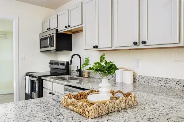 a view of a kitchen with a sink and a window